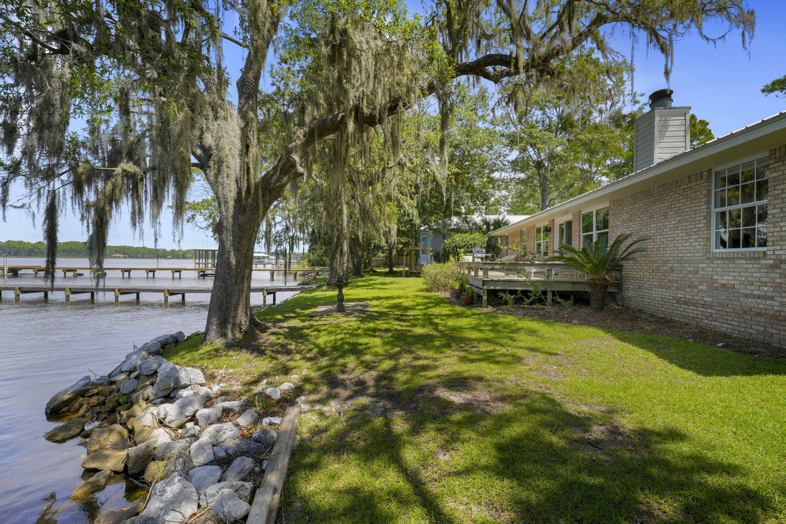 94 George Ellis Point Road Freeport, FL 32439 - Photo 24 of 63 a backyard of a house with lots of green space