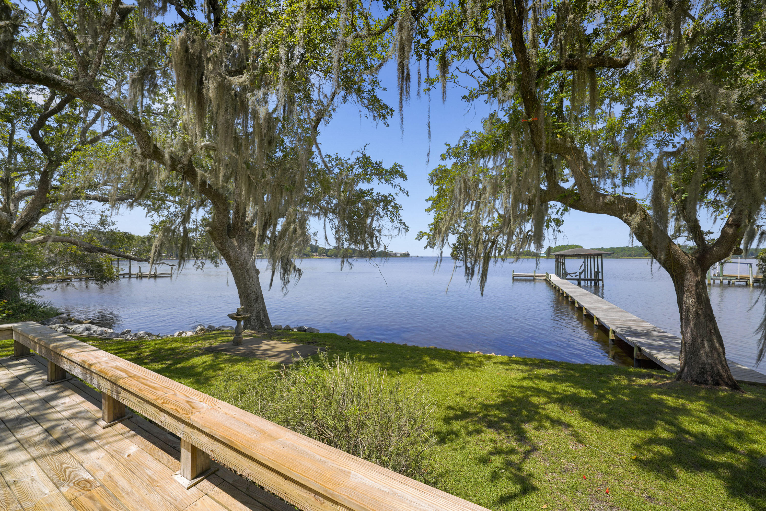 94 George Ellis Point Road Freeport, FL 32439 - Photo 27 of 63 a view of yard with tree in the background