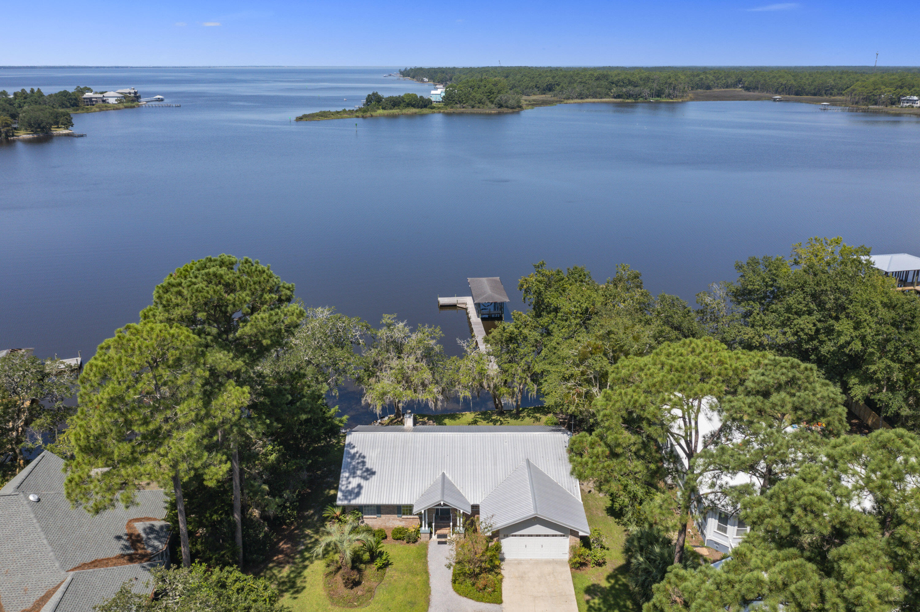 94 George Ellis Point Road Freeport, FL 32439 - Photo 3 of 63 an aerial view of a houses with a lake view