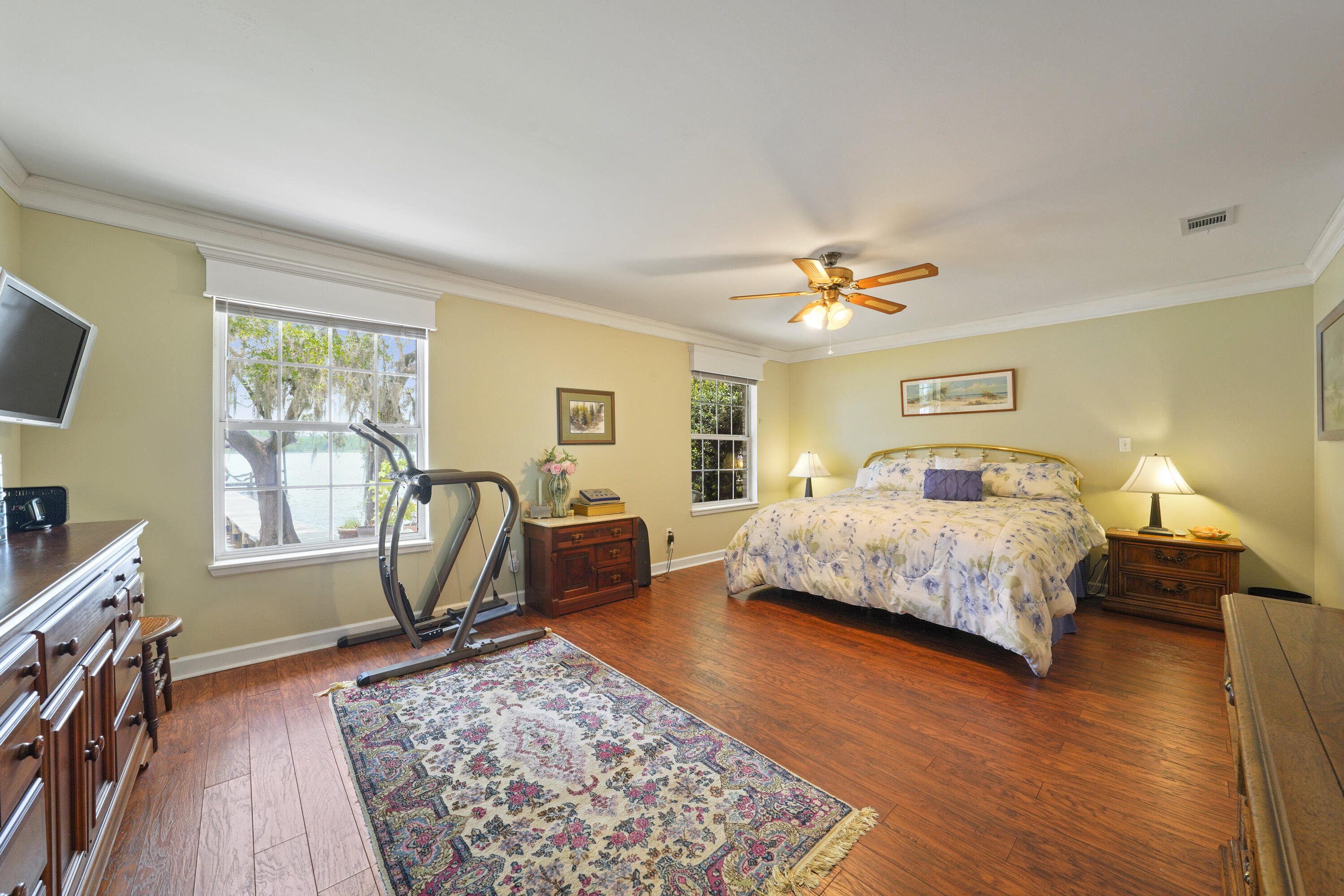 94 George Ellis Point Road Freeport, FL 32439 - Photo 38 of 63 a bedroom with a bed a table and chair with the wooden floor