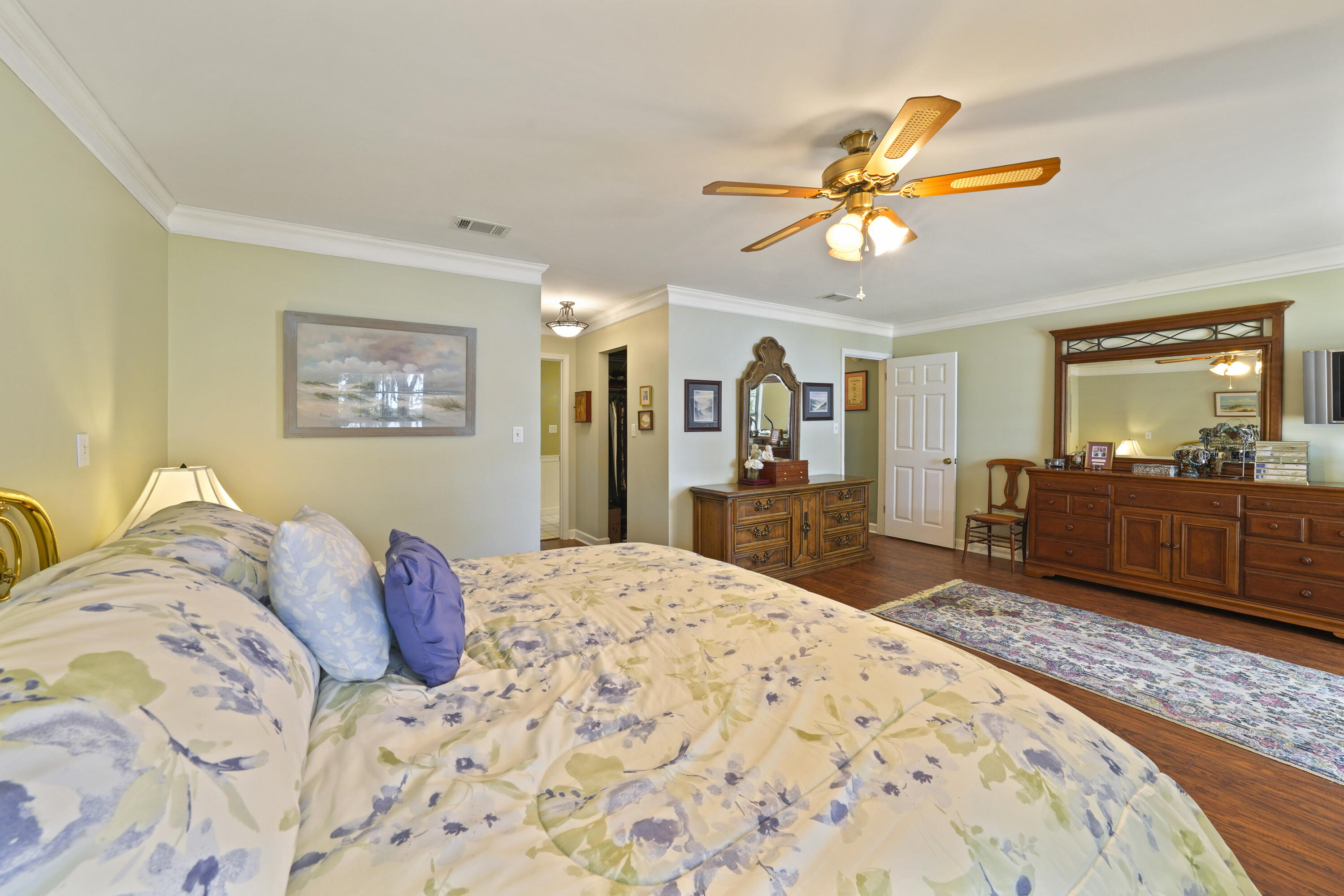 94 George Ellis Point Road Freeport, FL 32439 - Photo 39 of 63 a bedroom with a bed and a dresser in it