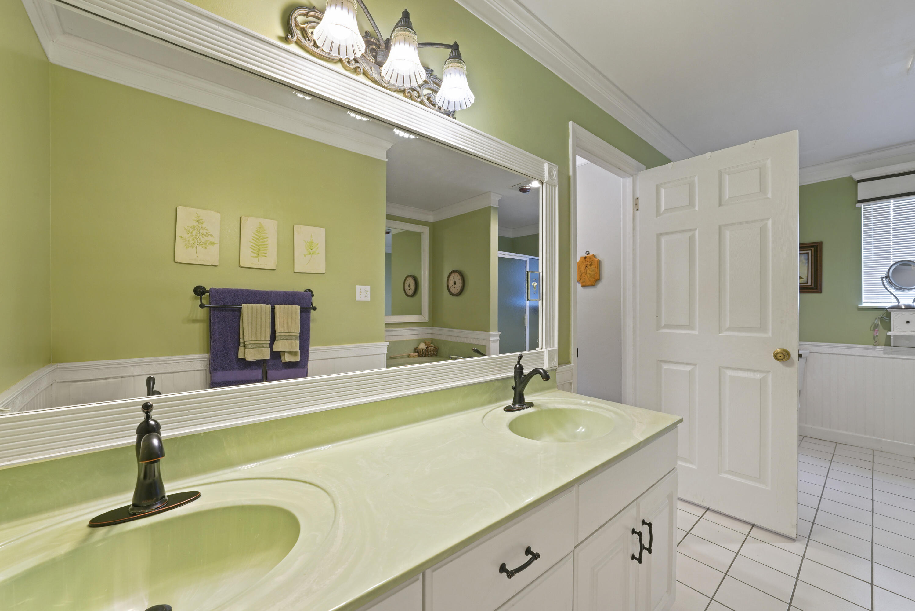 94 George Ellis Point Road Freeport, FL 32439 - Photo 40 of 63 a bathroom with a sink and a mirror