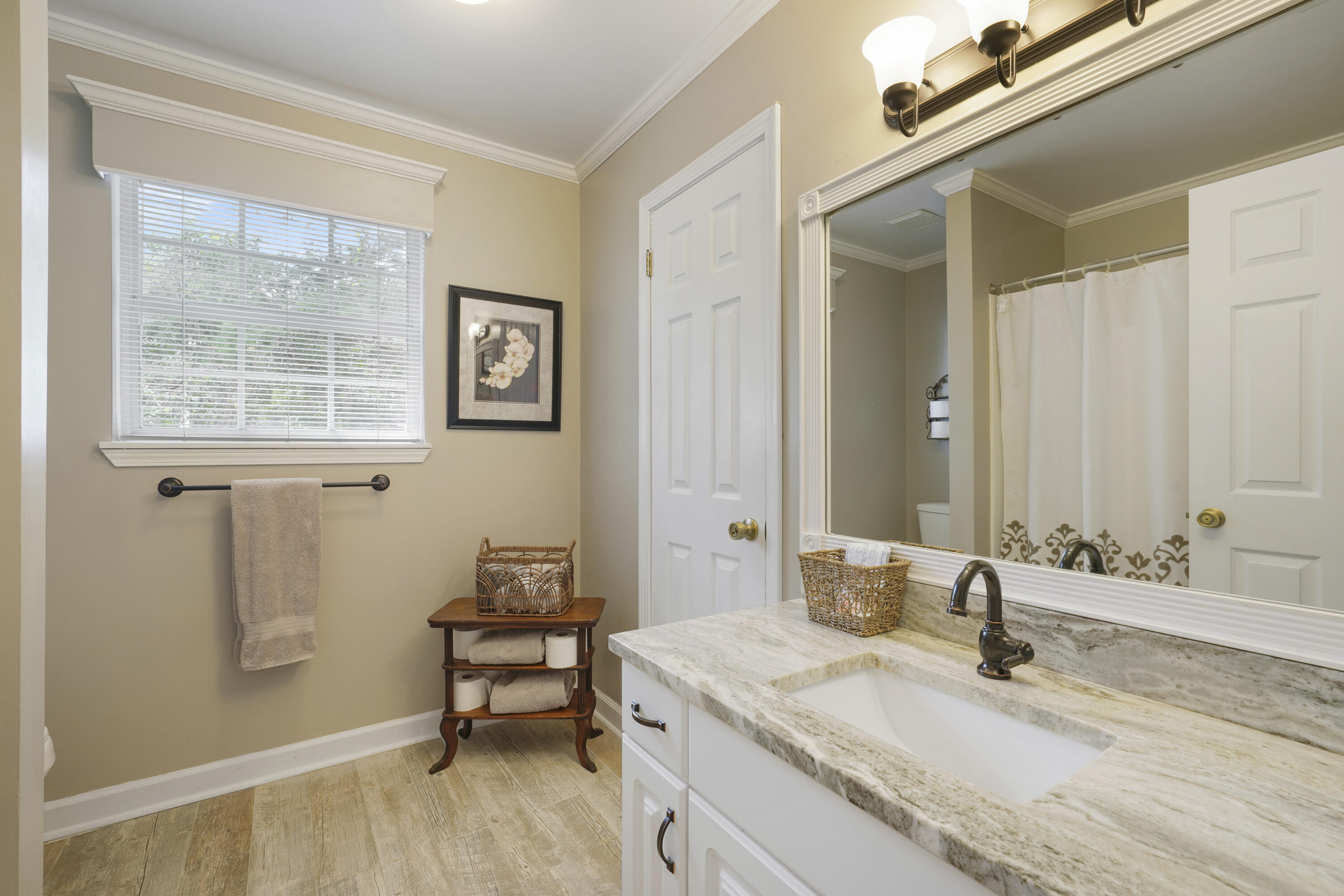 94 George Ellis Point Road Freeport, FL 32439 - Photo 45 of 63 a bathroom with a granite countertop sink a mirror and a