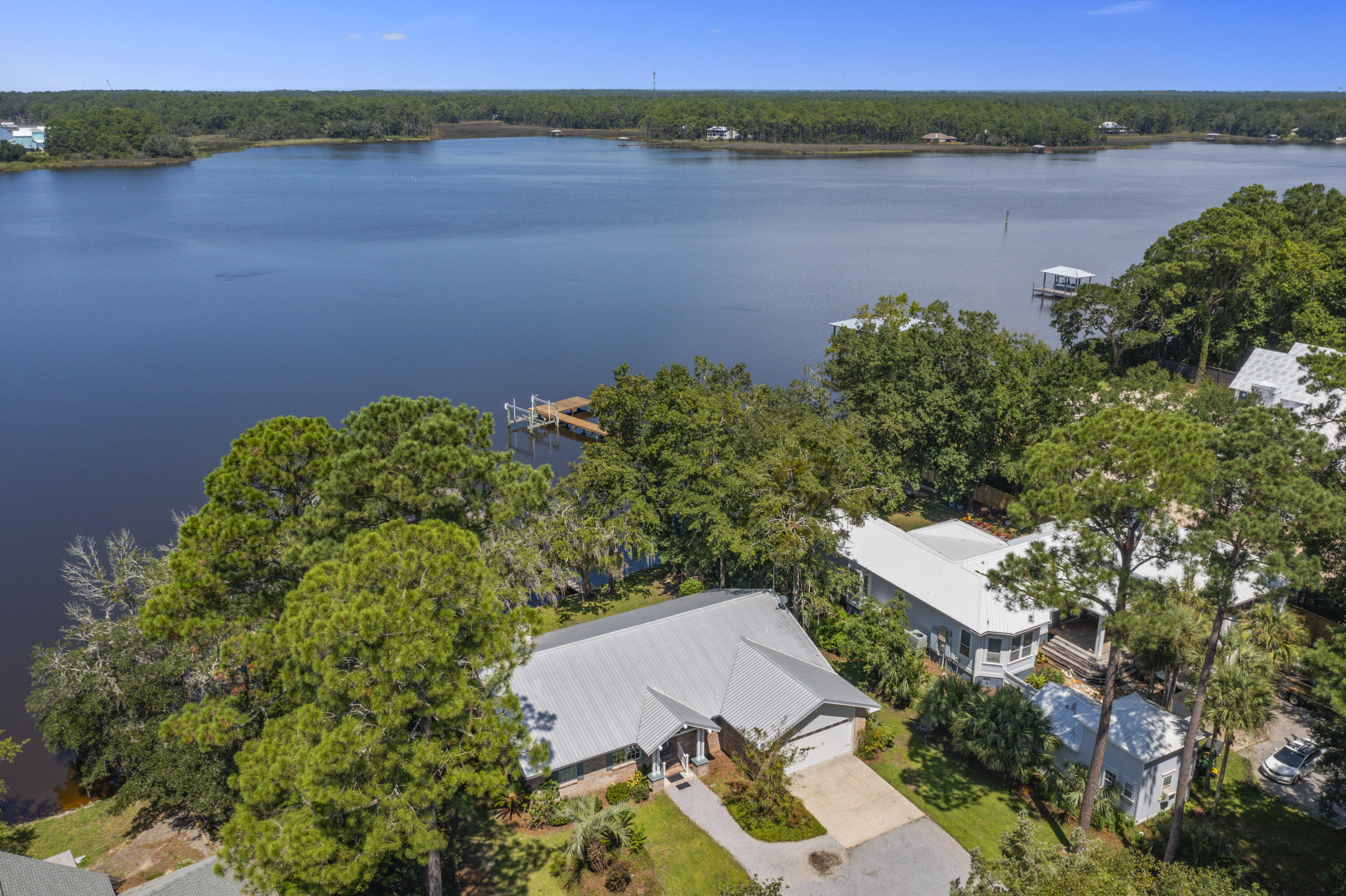 94 George Ellis Point Road Freeport, FL 32439 - Photo 48 of 63 an aerial view of a house with a lake view