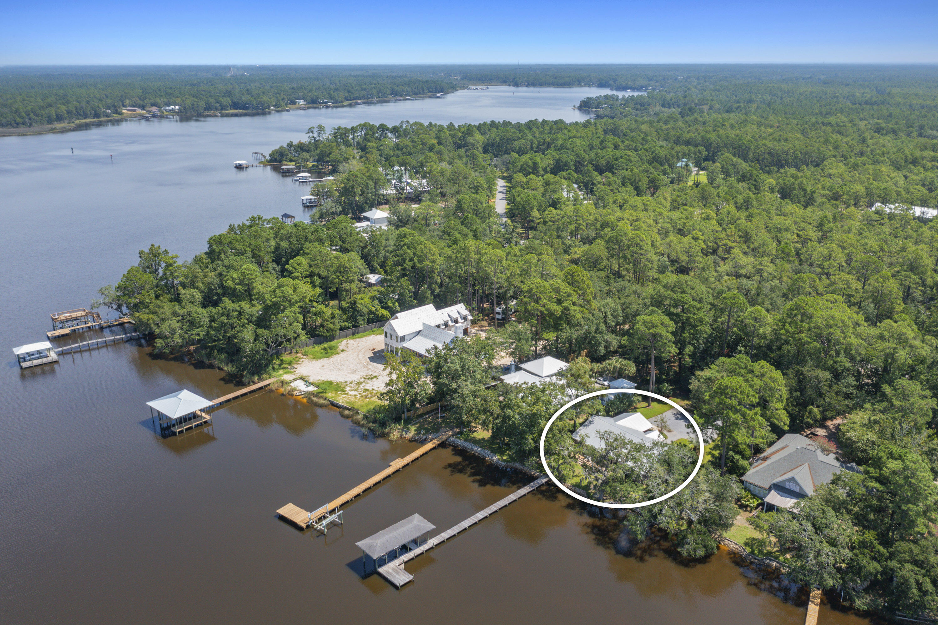 94 George Ellis Point Road Freeport, FL 32439 - Photo 60 of 63 an aerial view of a house with a yard and lake view