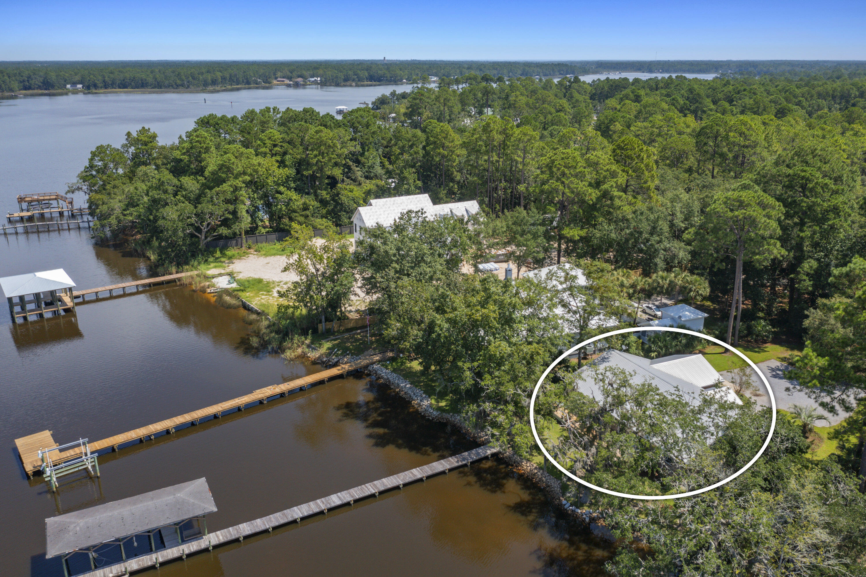 94 George Ellis Point Road Freeport, FL 32439 - Photo 62 of 63 an aerial view of a house with a yard and lake view