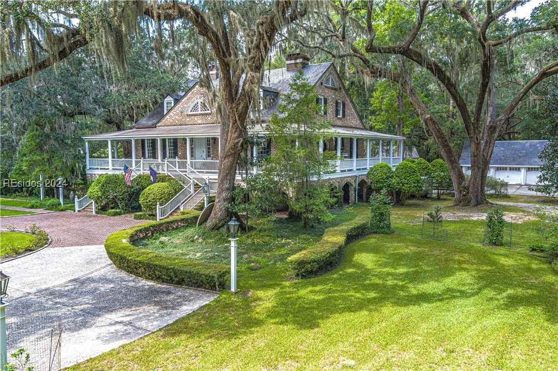 92 Dean Hall Road Seabrook, SC 29940 - Photo 3 of 99 1972 and 1996 renovations of the primary residence inside and out; slate roof materials, solid wood Doric columns; a three level "raised cottage" design with porches surrounding all sides
