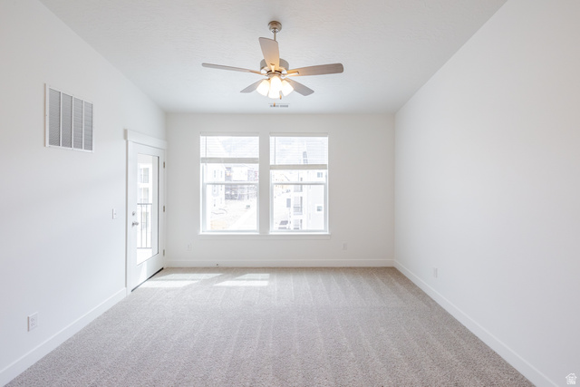 693 West 4500th South, Unit O303 Mapleton, UT 84664 - Photo 14 of 15 Empty room with light colored carpet and ceiling fan