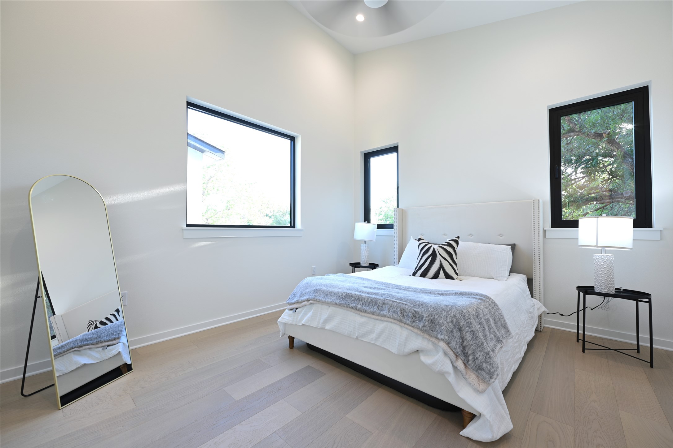 4410 Glomar Avenue, Unit 2 Austin, TX 78721 - Photo 17 of 24 En-suite Master bedroom, cathedral ceilings with recessed lighting, walk-in closet