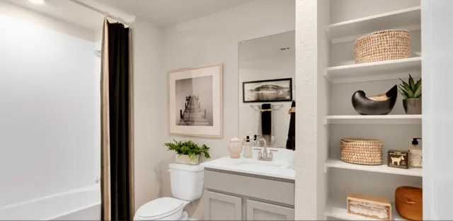 a bedroom with a bed and a dresser in it