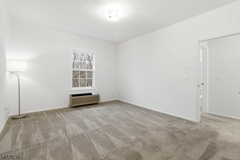 5301 Richmond Road, Unit 301 West Milford, NJ 07480 - Photo 18 of 33 an empty room with windows