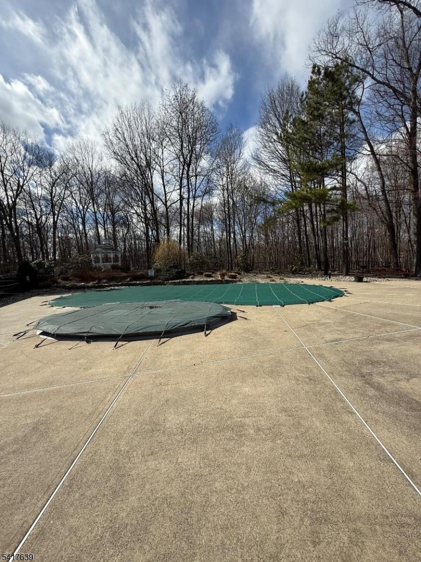 5301 Richmond Road, Unit 301 West Milford, NJ 07480 - Photo 23 of 33 a view of outdoor space with lots of trees in the background