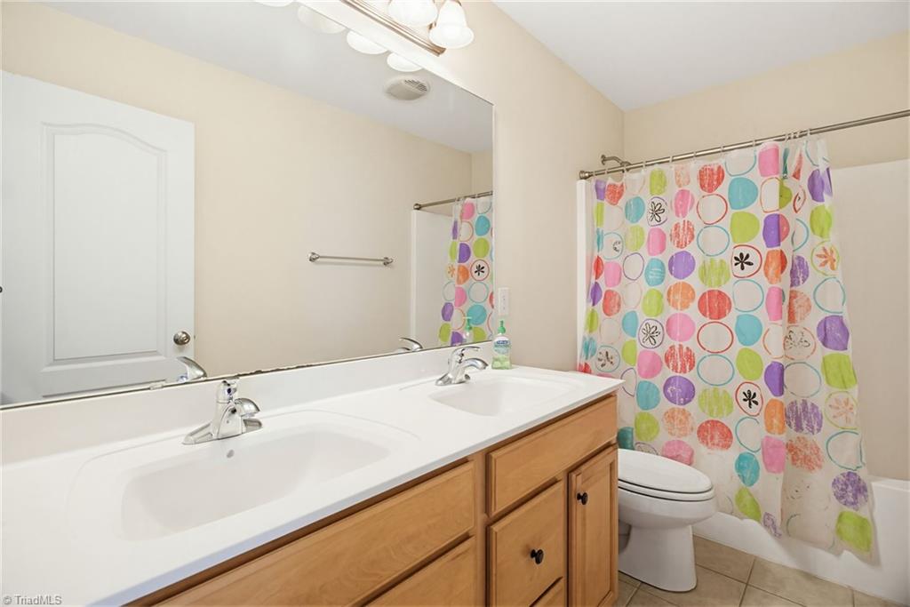 8204 Brotherstwo Road Colfax, NC 27235 - Photo 38 of 50 Full bath upstairs
