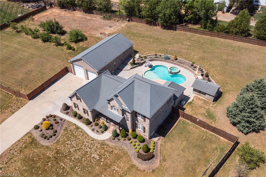 8204 Brotherstwo Road Colfax, NC 27235 - Photo 4 of 50 Aerial view of house, pool and building