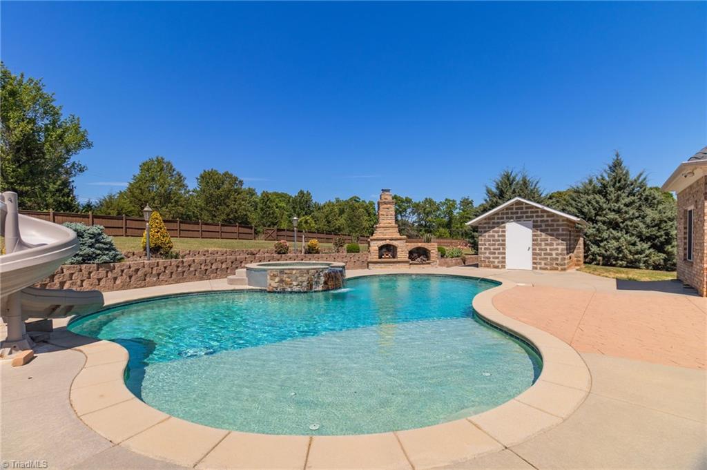 8204 Brotherstwo Road Colfax, NC 27235 - Photo 5 of 50 Concrete resort style pool with multi-depth design from 1' to 10'.