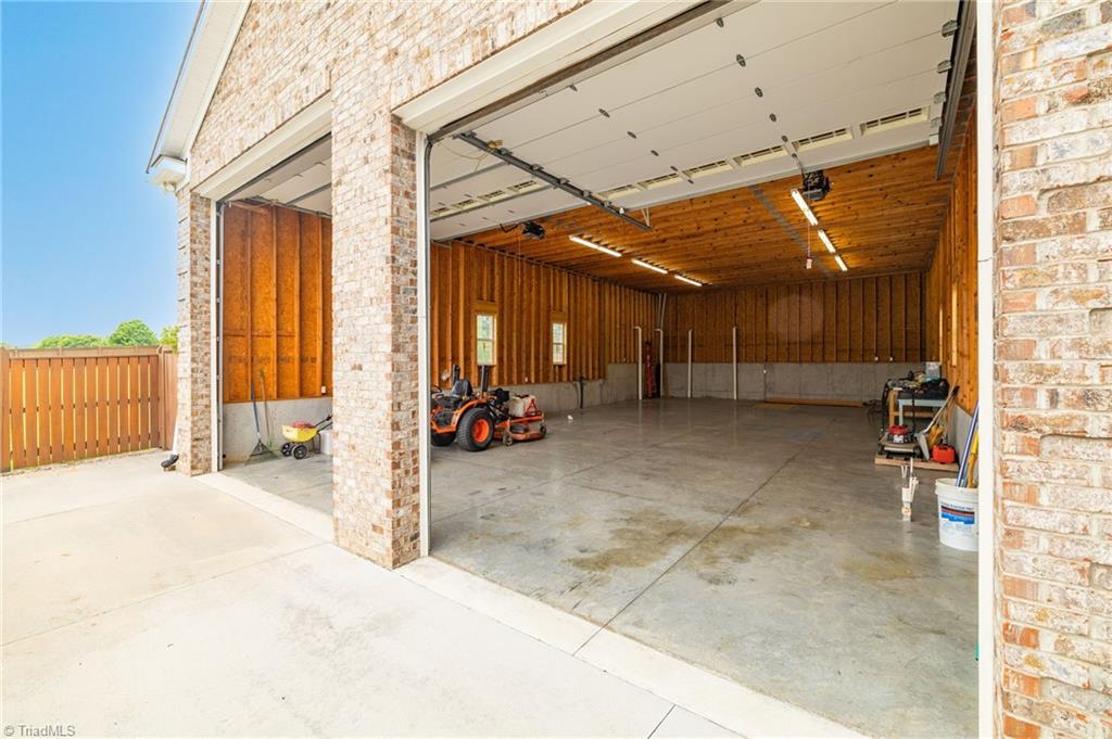8204 Brotherstwo Road Colfax, NC 27235 - Photo 8 of 50 Both garage doors have commercial grade motors