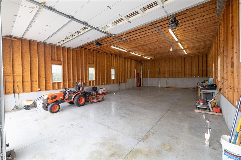 8204 Brotherstwo Road Colfax, NC 27235 - Photo 9 of 50 16' ceilings with 2x6 construction truss system and walls.