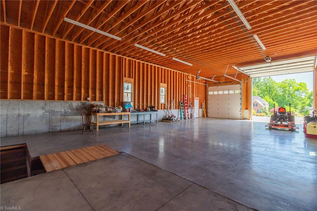 8204 Brotherstwo Road Colfax, NC 27235 - Photo 10 of 50 6" poured concrete floor with polished finish, poured concrete foundation, RV hookup, water faucets and plumbed for a bathroom