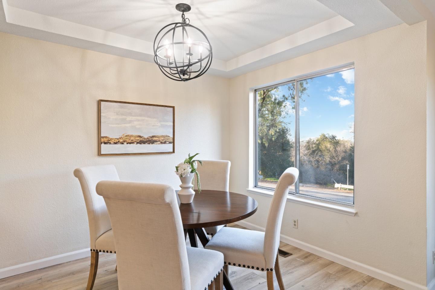 818 Coyote Road San Jose, CA 95111 - Photo 11 of 39 a view of a dining room with furniture window and wooden floor