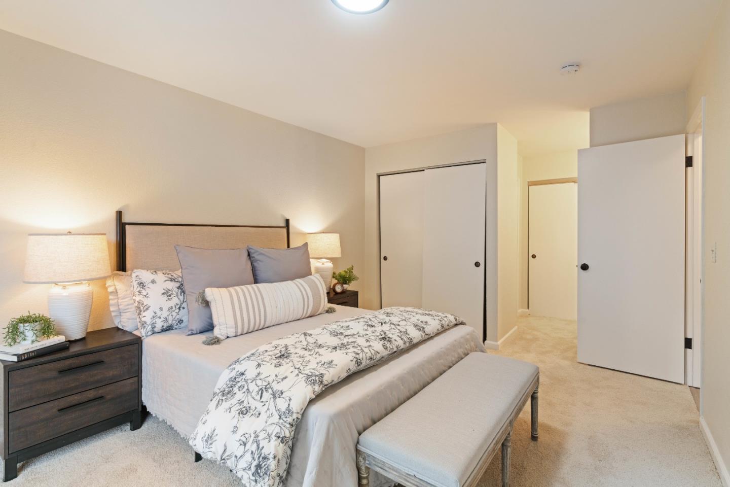 818 Coyote Road San Jose, CA 95111 - Photo 13 of 39 a bedroom with a bed and a lamp