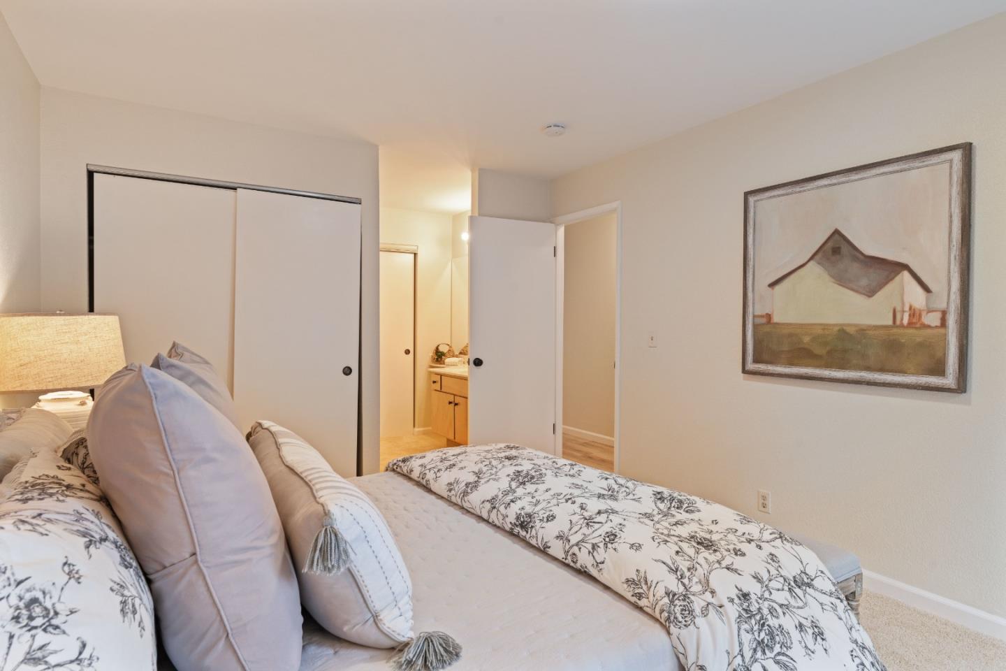 818 Coyote Road San Jose, CA 95111 - Photo 14 of 39 a bedroom with a bed and a painting on the wall