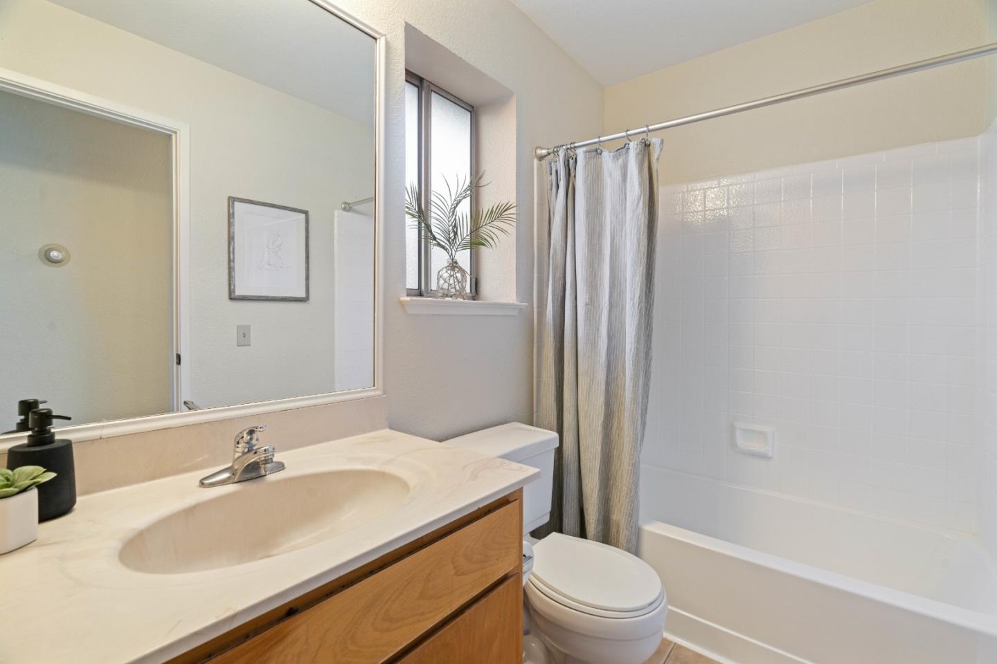 818 Coyote Road San Jose, CA 95111 - Photo 21 of 39 a bathroom with a granite countertop sink toilet and shower