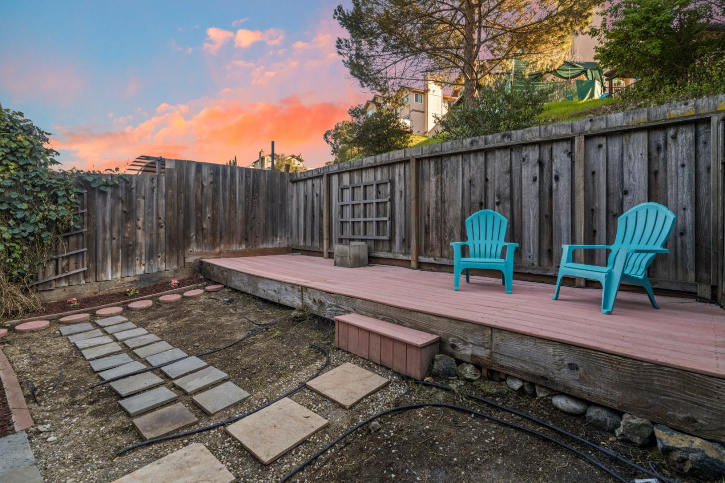 818 Coyote Road San Jose, CA 95111 - Photo 24 of 39 a backyard with table and chairs with wooden fence