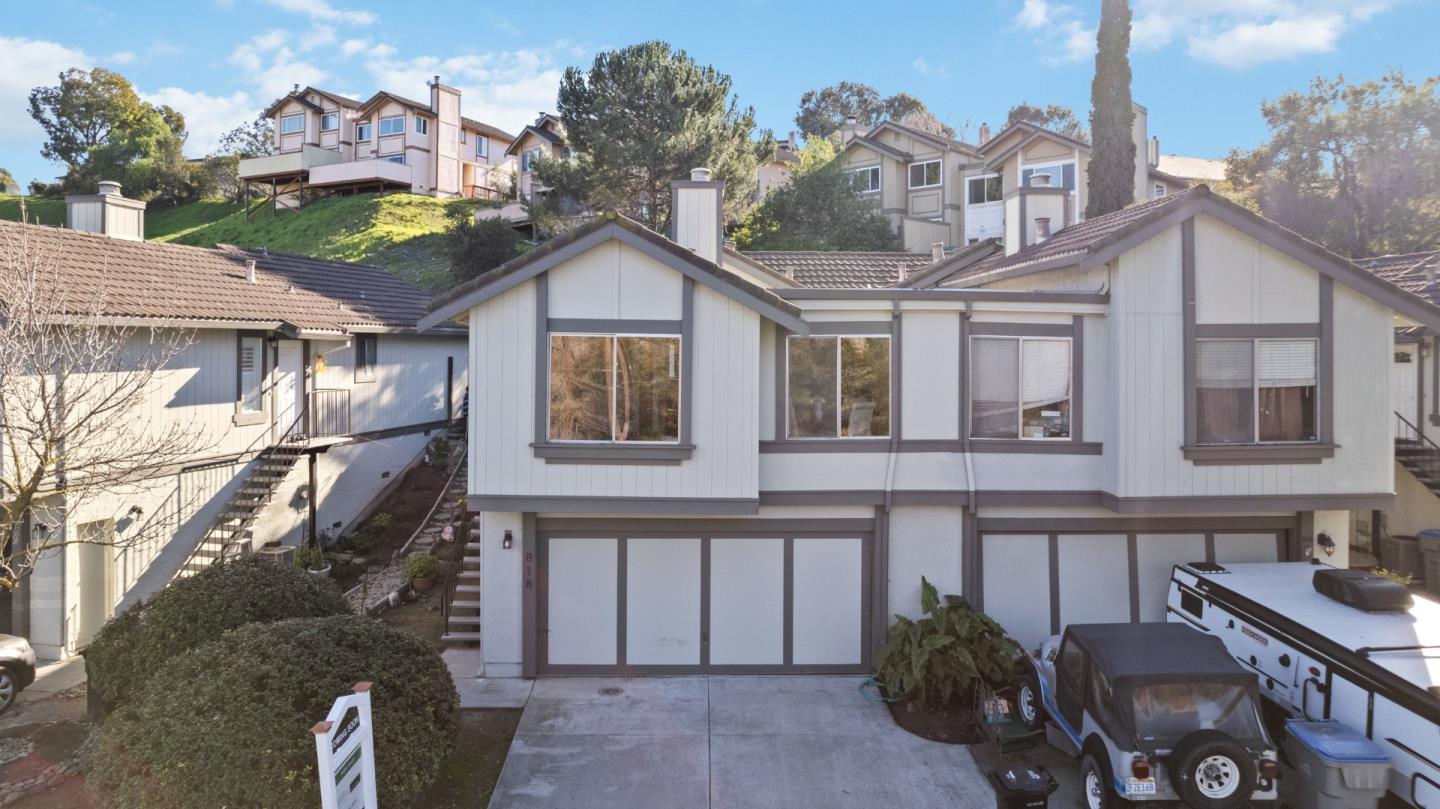 818 Coyote Road San Jose, CA 95111 - Photo 31 of 39 a view of a house with a yard and balcony
