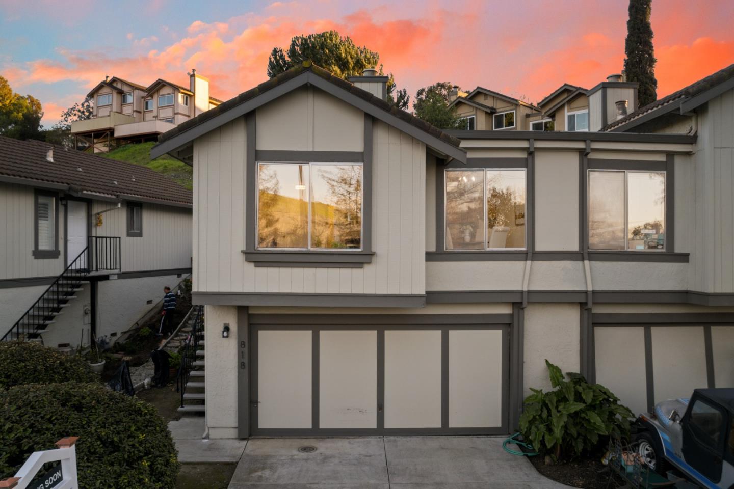 818 Coyote Road San Jose, CA 95111 - Photo 35 of 39 a view of a house with large windows and flower plants