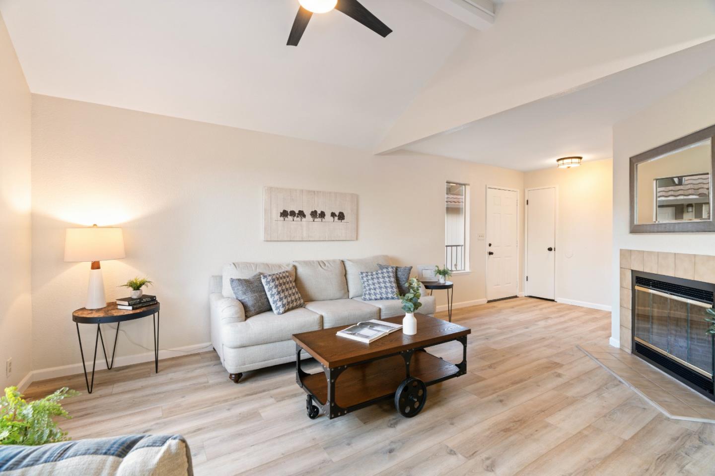 818 Coyote Road San Jose, CA 95111 - Photo 6 of 39 a living room with furniture and a fireplace
