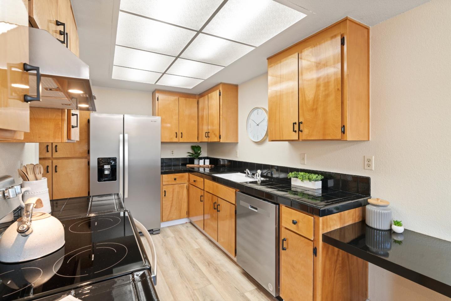 818 Coyote Road San Jose, CA 95111 - Photo 8 of 39 a kitchen with stainless steel appliances granite countertop a sink stove and refrigerator