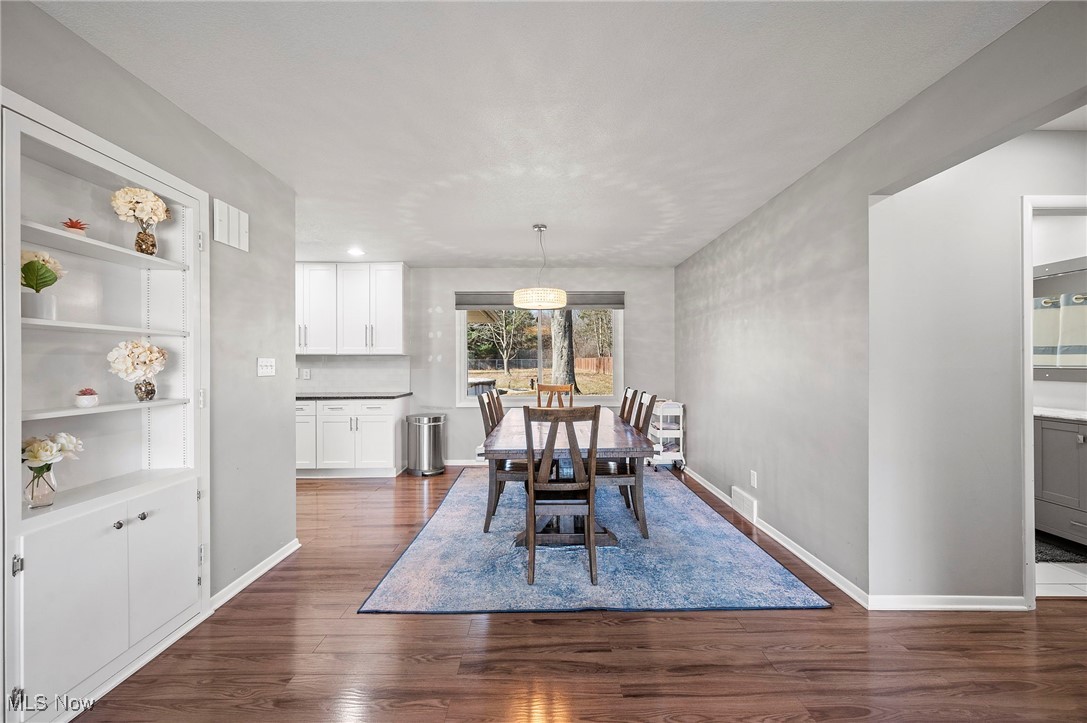19384 Howe Road Strongsville, OH 44136 - Photo 7 of 40 Dining space with baseboards and dark wood-style flooring