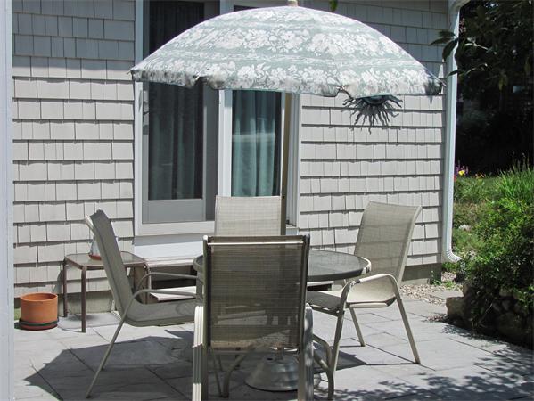 25 Arlington Road Wareham, MA 02571 - Photo 12 of 17 a view of patio with table and chairs and potted plants