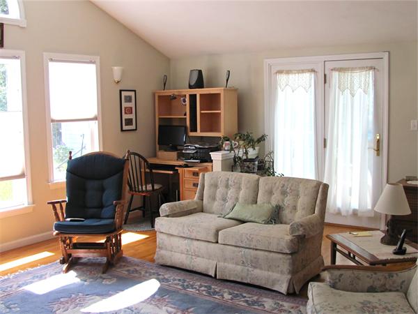 25 Arlington Road Wareham, MA 02571 - Photo 3 of 17 a living room with furniture a flat screen tv and a window