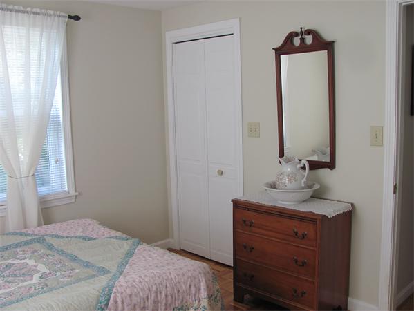 25 Arlington Road Wareham, MA 02571 - Photo 6 of 17 a bedroom with a bed and a mirror