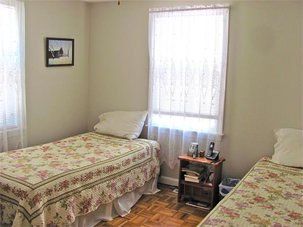 25 Arlington Road Wareham, MA 02571 - Photo 7 of 17 a bedroom with a bed and wooden floor