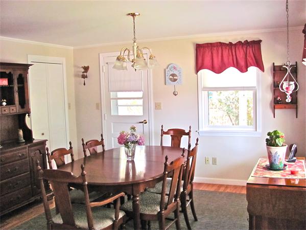 25 Arlington Road Wareham, MA 02571 - Photo 9 of 17 a view of a dining room with furniture and chandelier