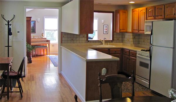 25 Arlington Road Wareham, MA 02571 - Photo 10 of 17 a kitchen with kitchen island a counter top space a sink stainless steel appliances and cabinets