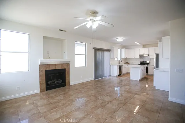 a view of a kitchen with a sink and a fireplace