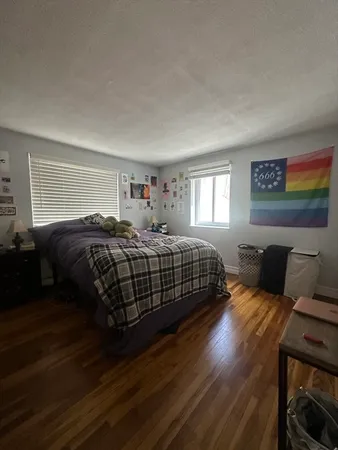 a bedroom with a bed and window