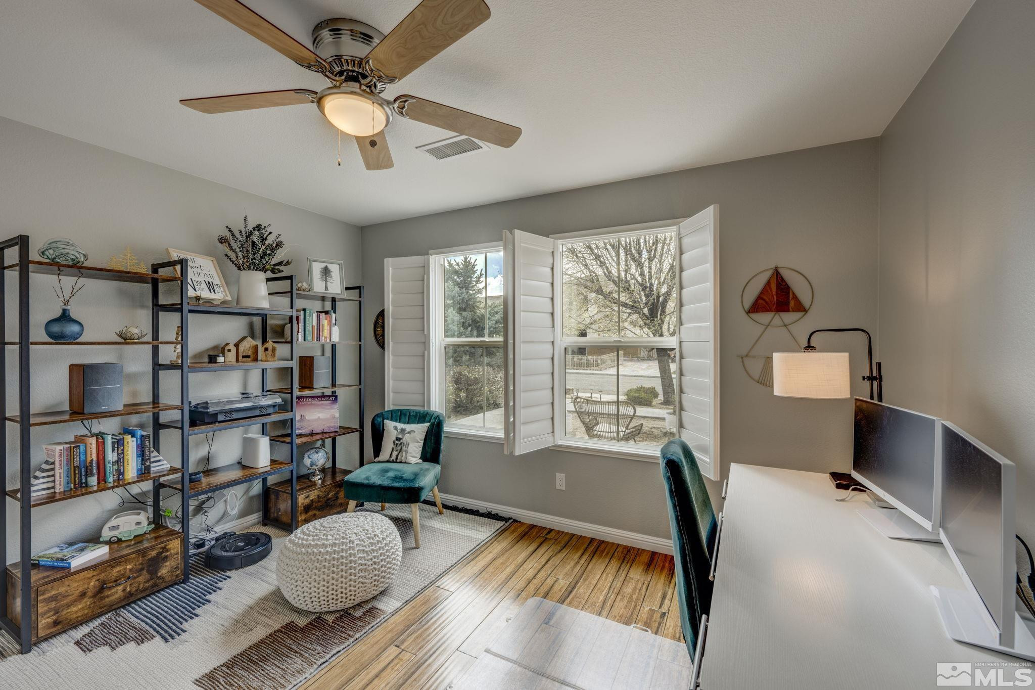 375 Pesaro Way Reno, NV 89521 - Photo 15 of 39 a bedroom with furniture and a book shelf
