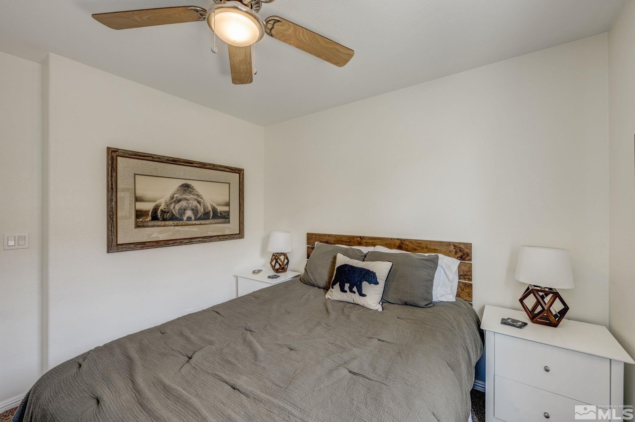375 Pesaro Way Reno, NV 89521 - Photo 25 of 39 a bedroom with a bed and ceiling fan