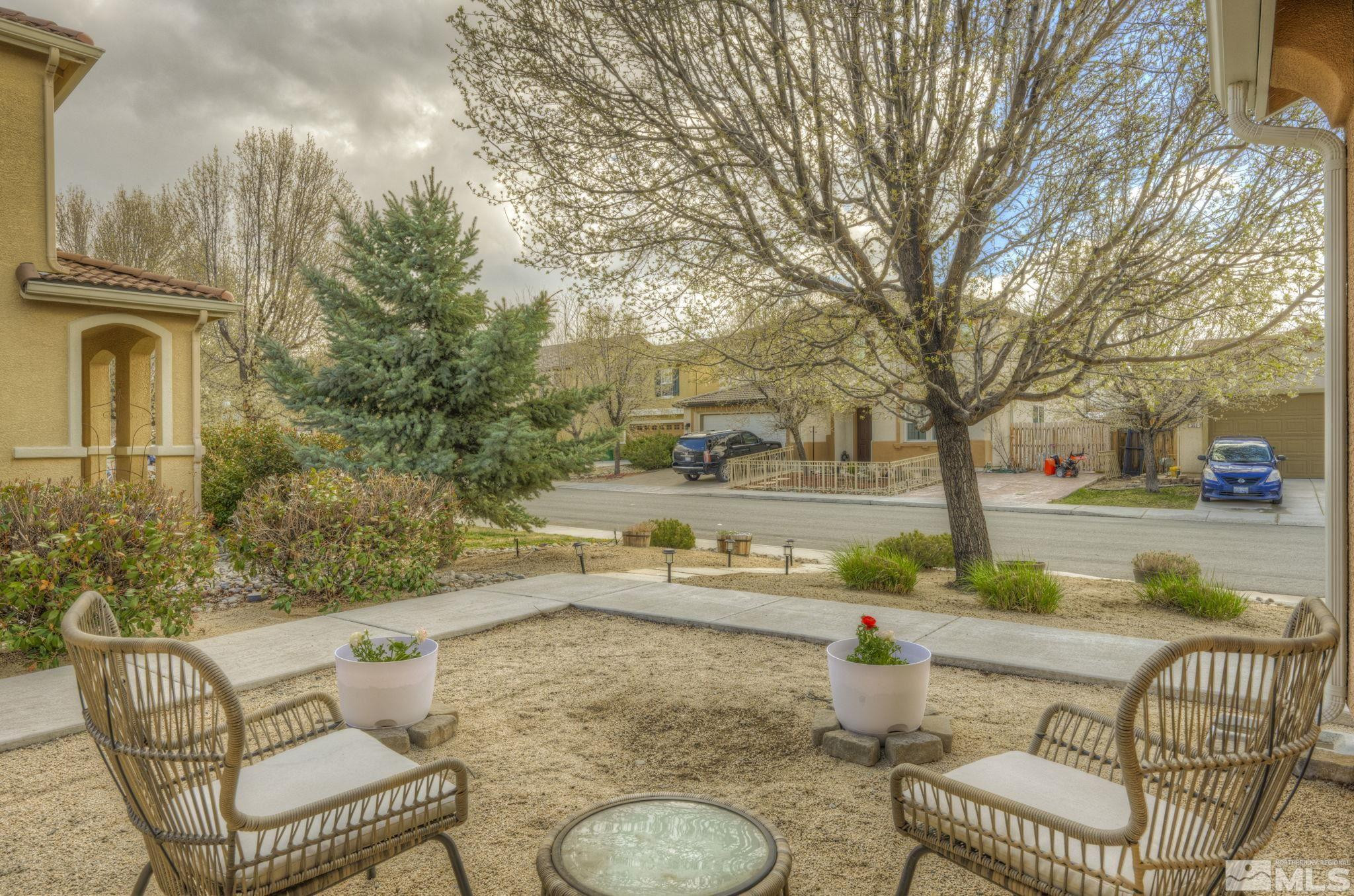 375 Pesaro Way Reno, NV 89521 - Photo 4 of 39 a backyard of a house with barbeque oven table and chairs