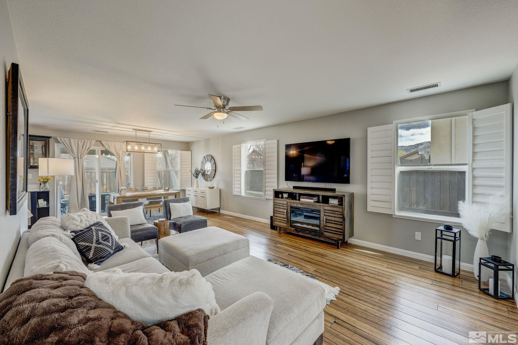 375 Pesaro Way Reno, NV 89521 - Photo 6 of 39 a living room with furniture and a flat screen tv