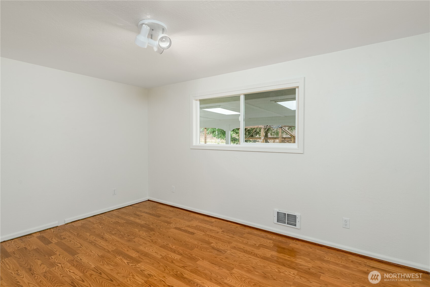 4109 South Reddick Road Port Angeles, WA 98363 - Photo 17 of 38 an empty room with a window