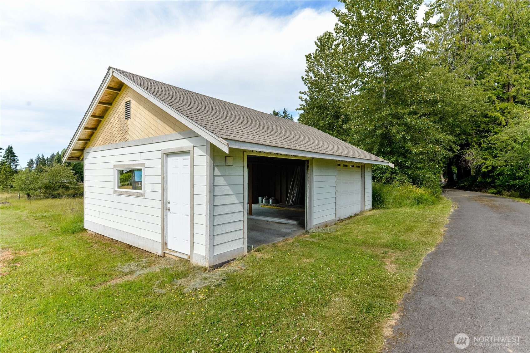 4109 South Reddick Road Port Angeles, WA 98363 - Photo 29 of 38 a view of a house with a yard