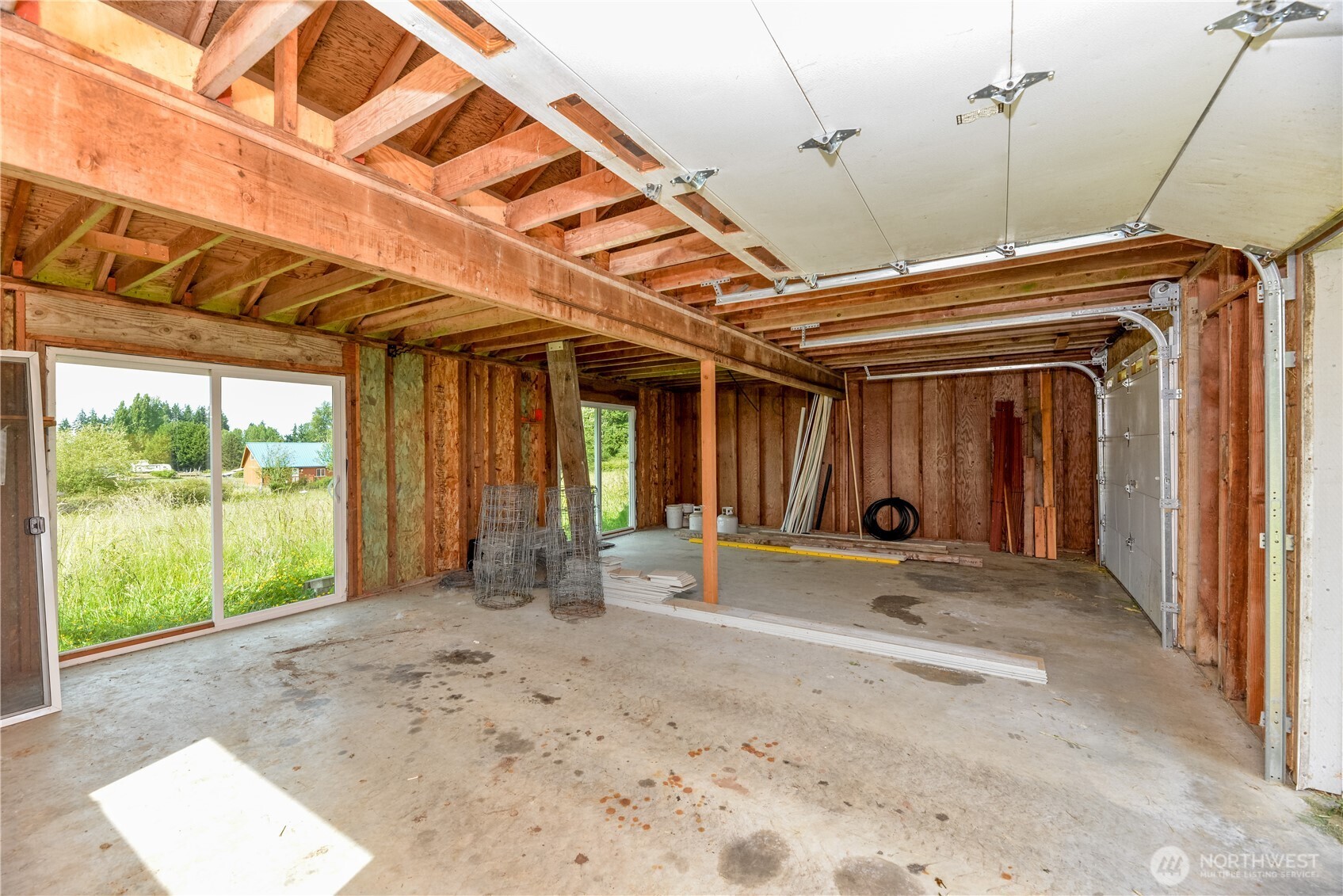 4109 South Reddick Road Port Angeles, WA 98363 - Photo 30 of 38 a view of a room with wooden floor and outdoor space