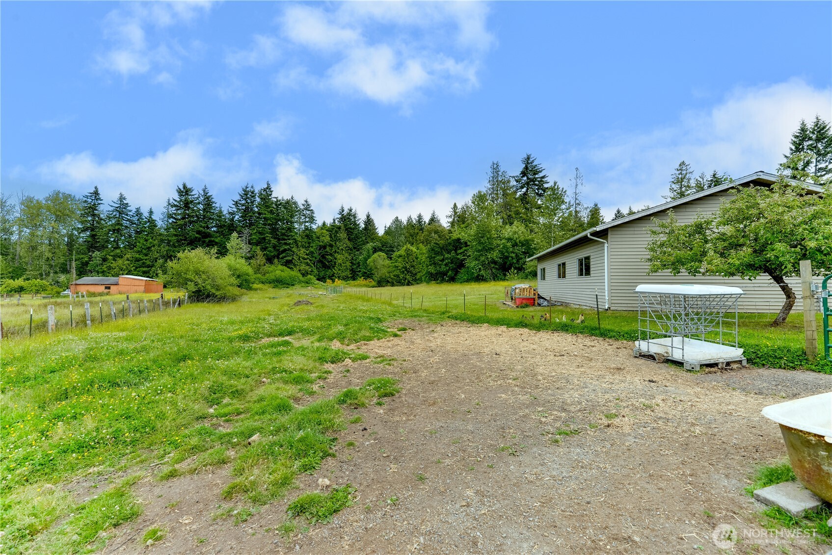 4109 South Reddick Road Port Angeles, WA 98363 - Photo 32 of 38 a front view of a house with a yard and garage