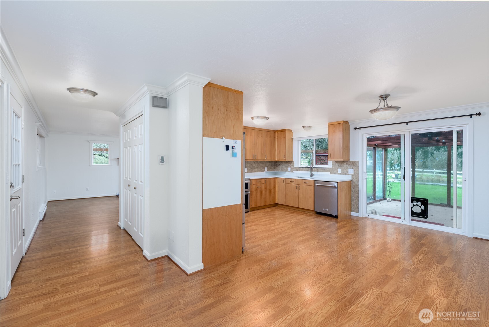 4109 South Reddick Road Port Angeles, WA 98363 - Photo 6 of 38 a view of a kitchen with furniture and wooden floor