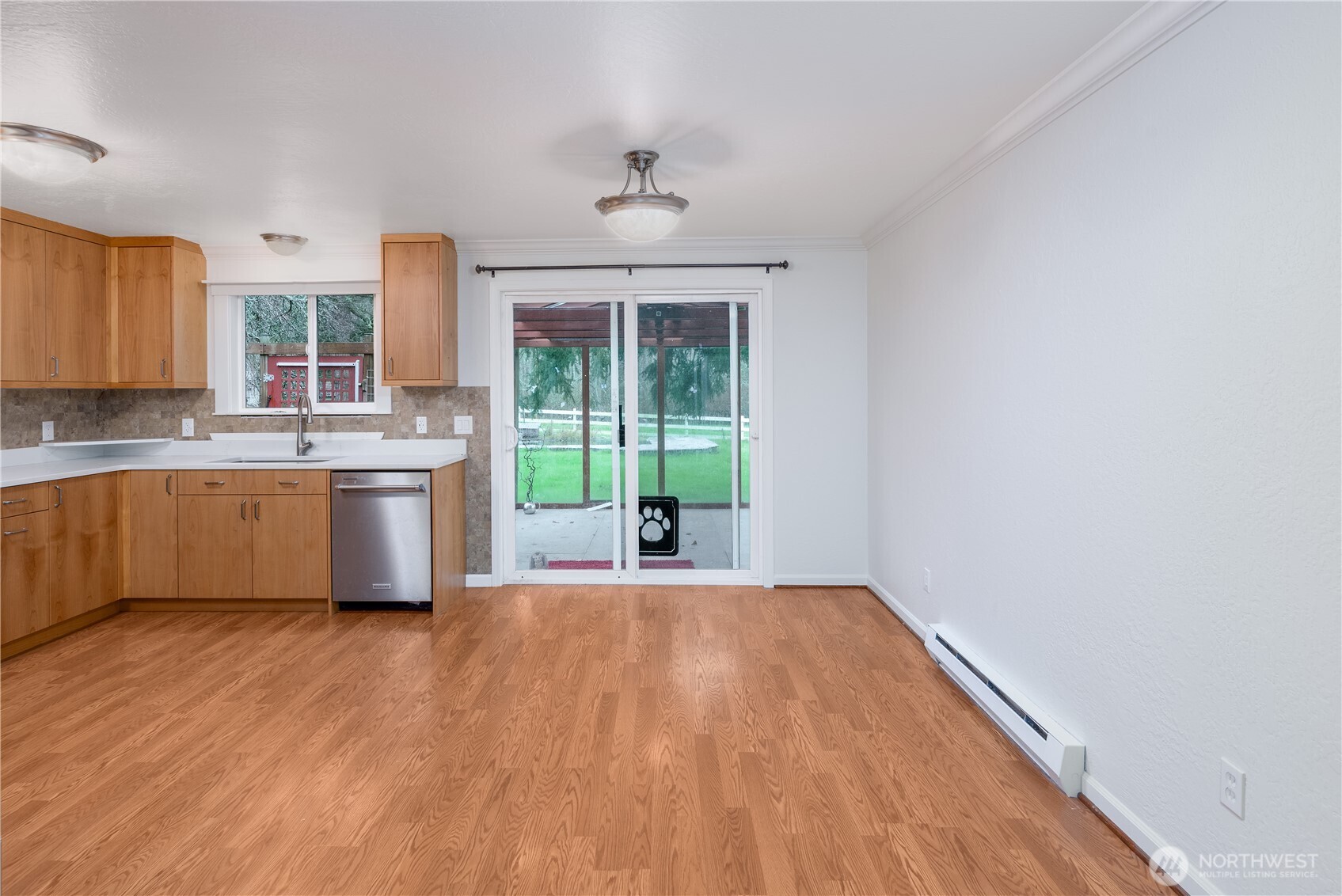 4109 South Reddick Road Port Angeles, WA 98363 - Photo 10 of 38 a view of a kitchen with wooden floor and a sink